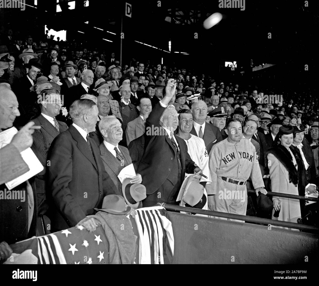 Left to right. Senators Pat Harrison, Robert Lafollette Jr., Charles L. McNary, Carter Glass, the Vice President, Bucky Harris who manages the Washington Senators, Postmaster General James A. Farley, N.Y. Yankees' Manager Joe McCarthy. Senator Allen J. Ellender is standing behind the Vice President Garner Stock Photo