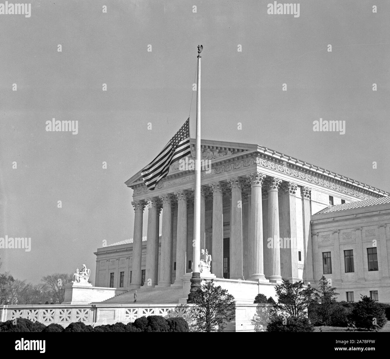 The flags in front of the United States Supreme Court were lowered to half-mast today out of respect to Associate Justice Pierce Butler ca. November 1939 Stock Photo