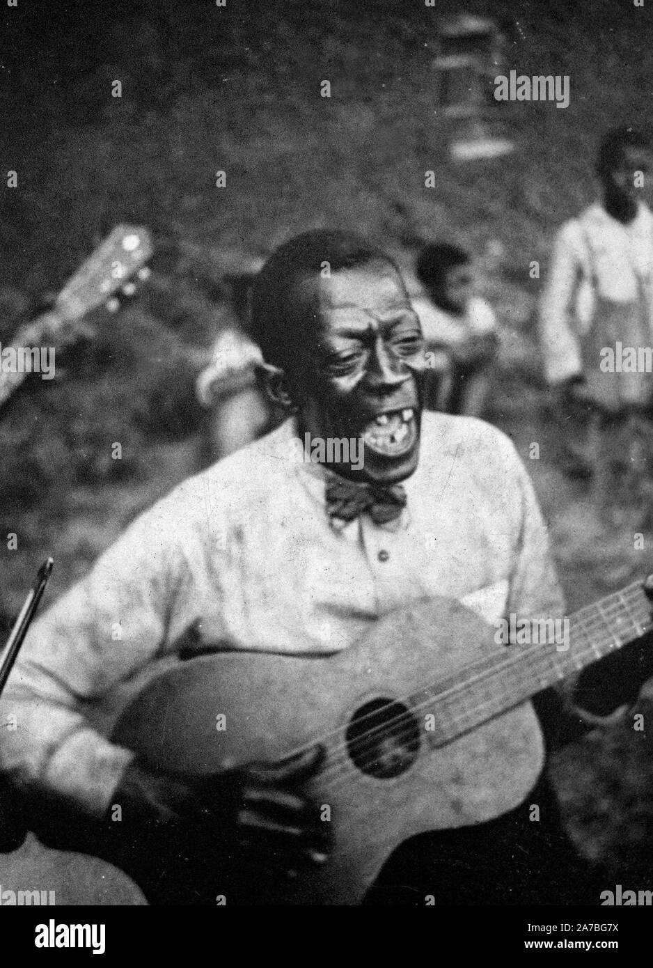 Stavin' Chain playing guitar and singing the ballad 'Batson,' Lafayette, La. June 1934 Stock Photo