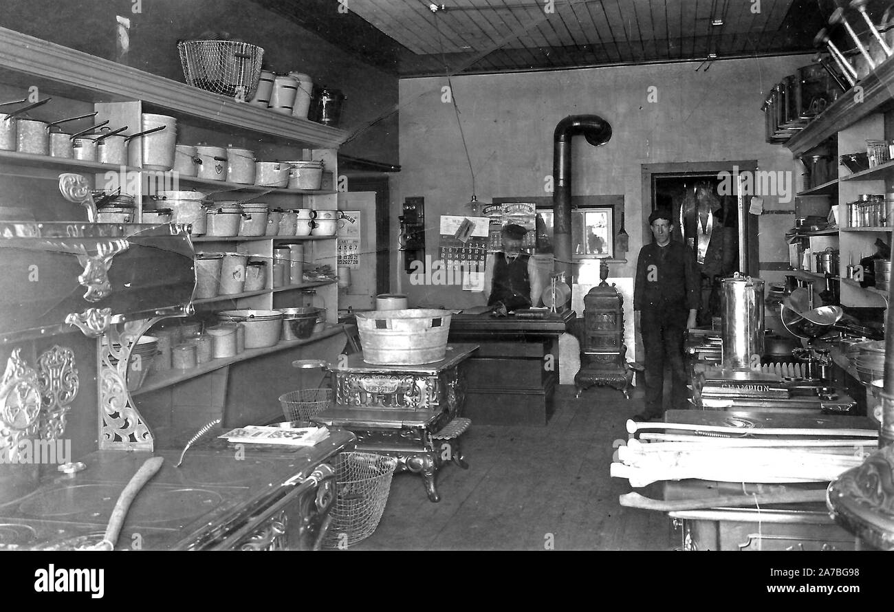 interior of a store selling kitchen equipment including pots, pans,  plungers and 'Perfection' and 'Champion' kitchen ranges ca. 1911 Stock  Photo - Alamy