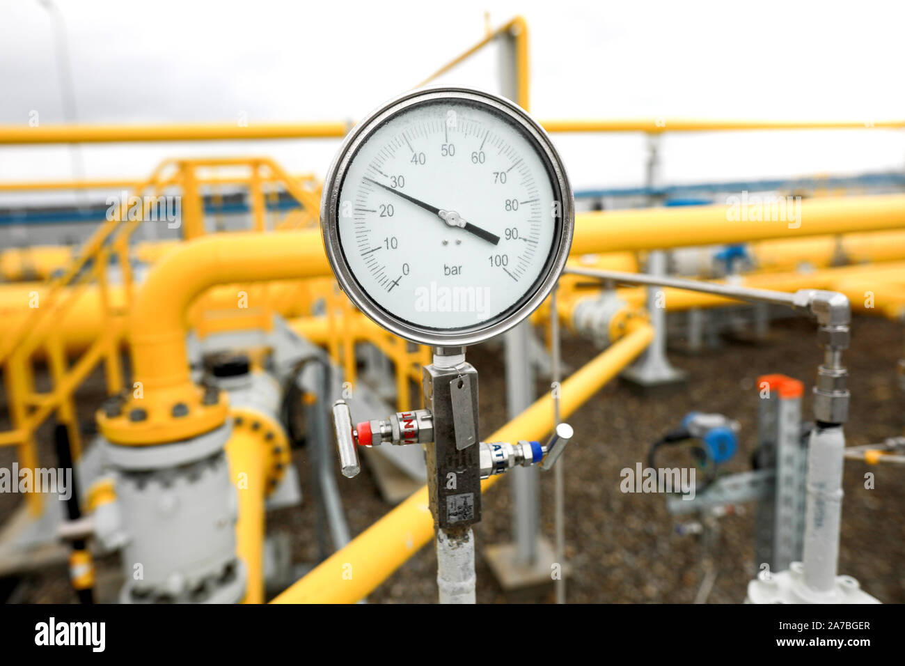 Industrial equipment (pipes, manometer/pressure gauge, levers, faucets,  indicators) in a natural gas compressor station Stock Photo - Alamy