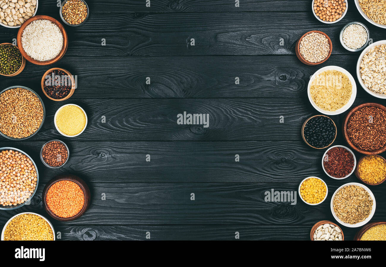 Various cereals, grains, seeds and beans, high fibre diet concept, photo filtered in vintage style, top view Stock Photo