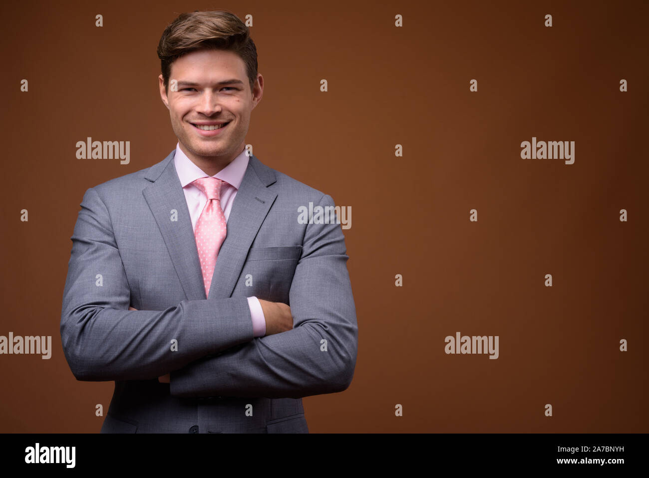 Studio shot of young handsome businessman in suit Stock Photo - Alamy