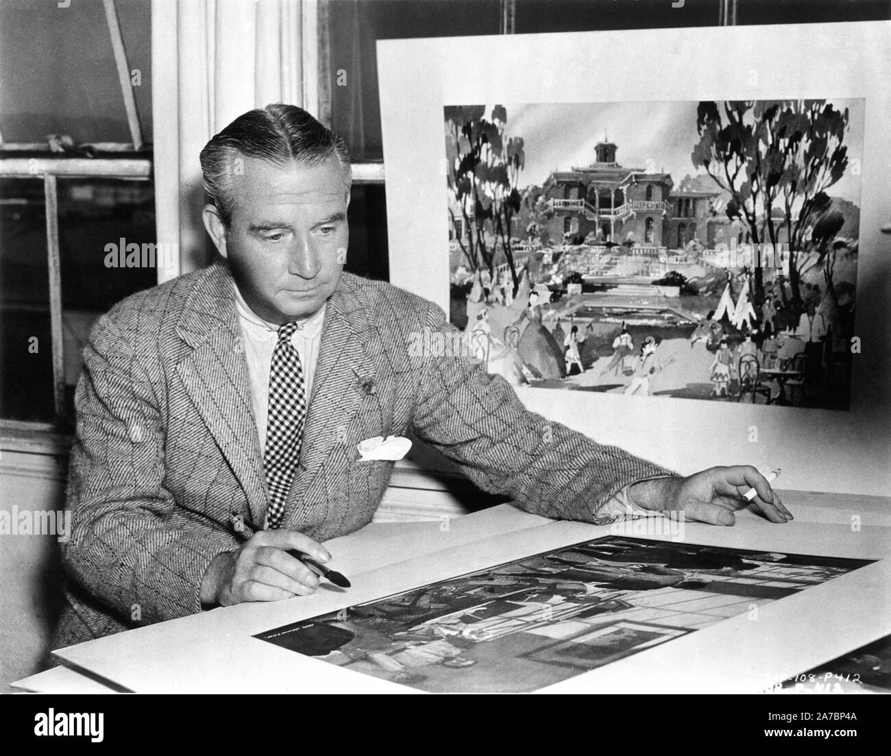 Production Designer WILLIAM CAMERON MENZIES with concept art for GONE WITH THE WIND 1939 director Victor Fleming novel Margaret Mitchell producer David O. Selznick Selznick International Pictures / Metro Goldwyn Mayer Stock Photo