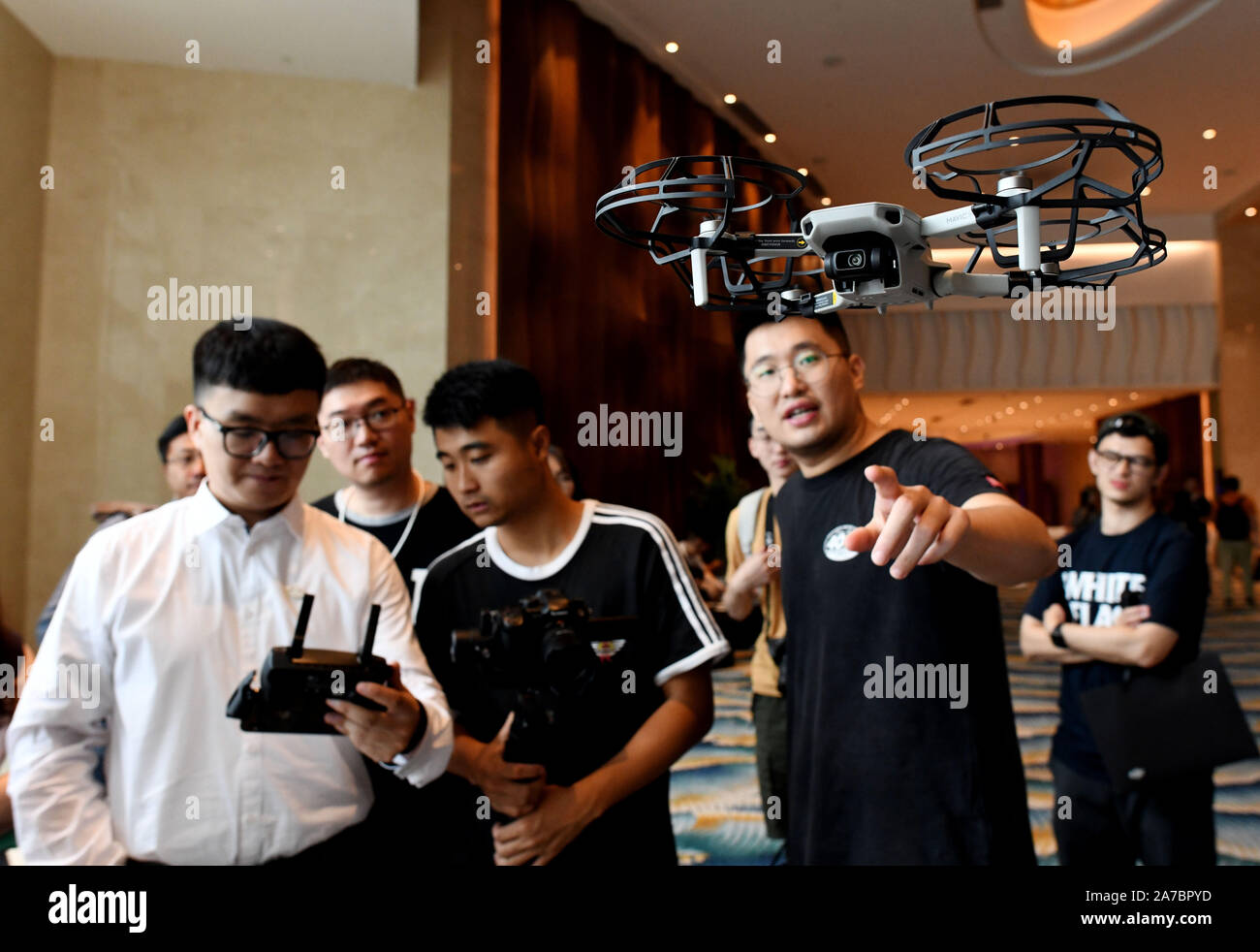 Beijing, China's Hainan Province. 31st Oct, 2019. A man experiences the  Mavic Mini drone unveiled during a new product launch event by DJI, a  famous Chinese drone maker, in Sanya, south China's