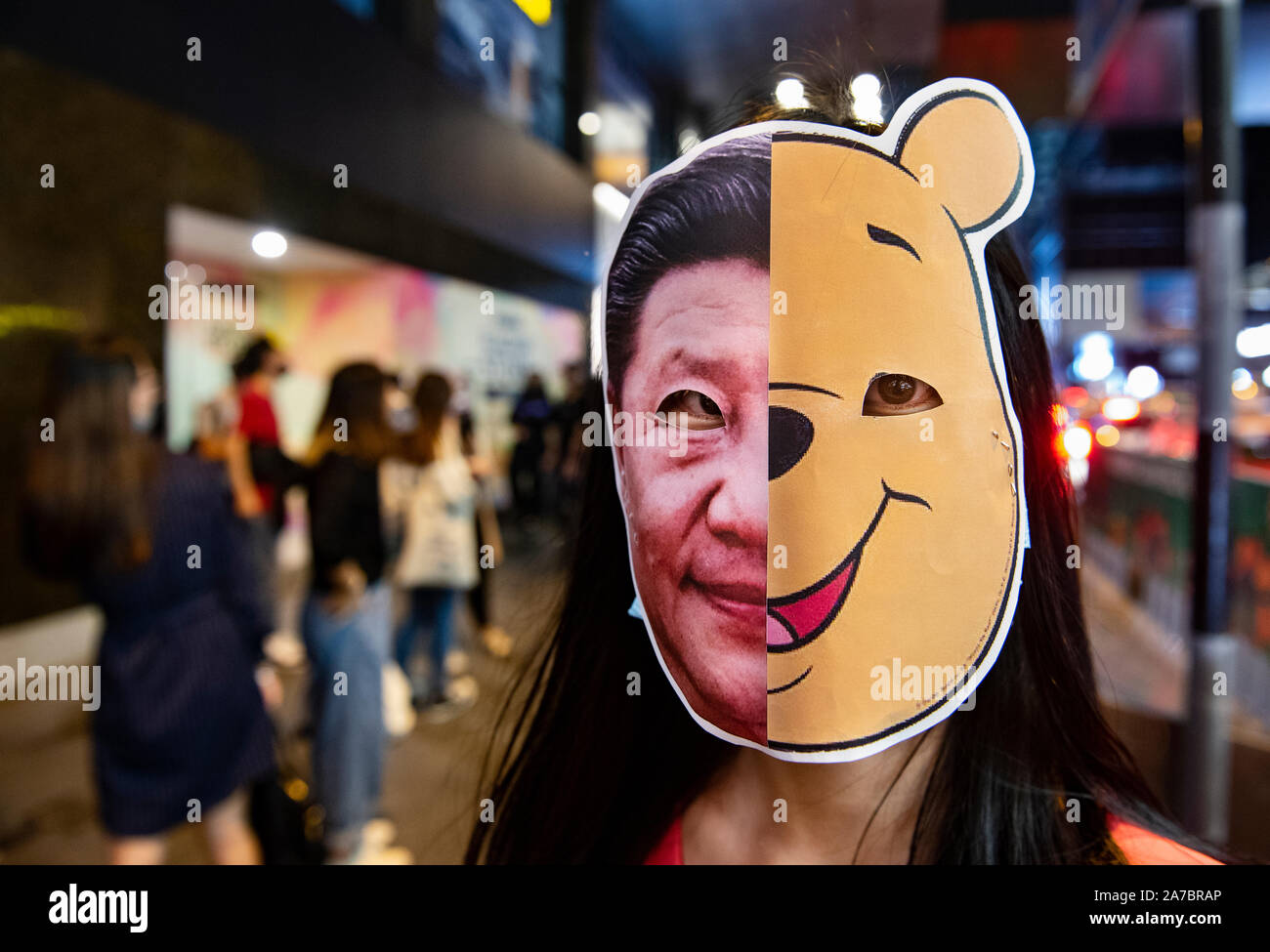 Hong Kong, China. 31st Oct, 2019. A protester wearing a Winnie the Pooh and Xi Jinping mask during the demonstration. Protesters at Halloween march in Hong Kong island despite police banned rallies and confront them during the night. Credit: SOPA Images Limited/Alamy Live News Stock Photo