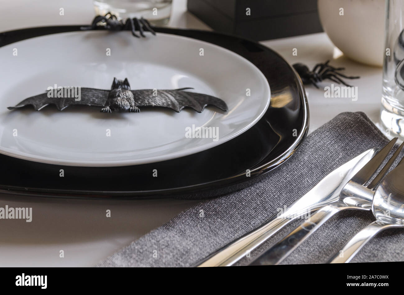 Elegant Halloween table settings in black white colors. Halloween party