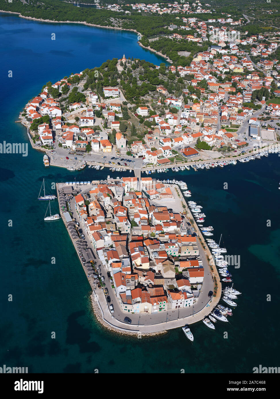 AERIAL VIEW. Picturesque town, peninsula and marina of Tribunj. Near Vodice, Šibenik-Knin County, Dalmatia, Croatia. Stock Photo