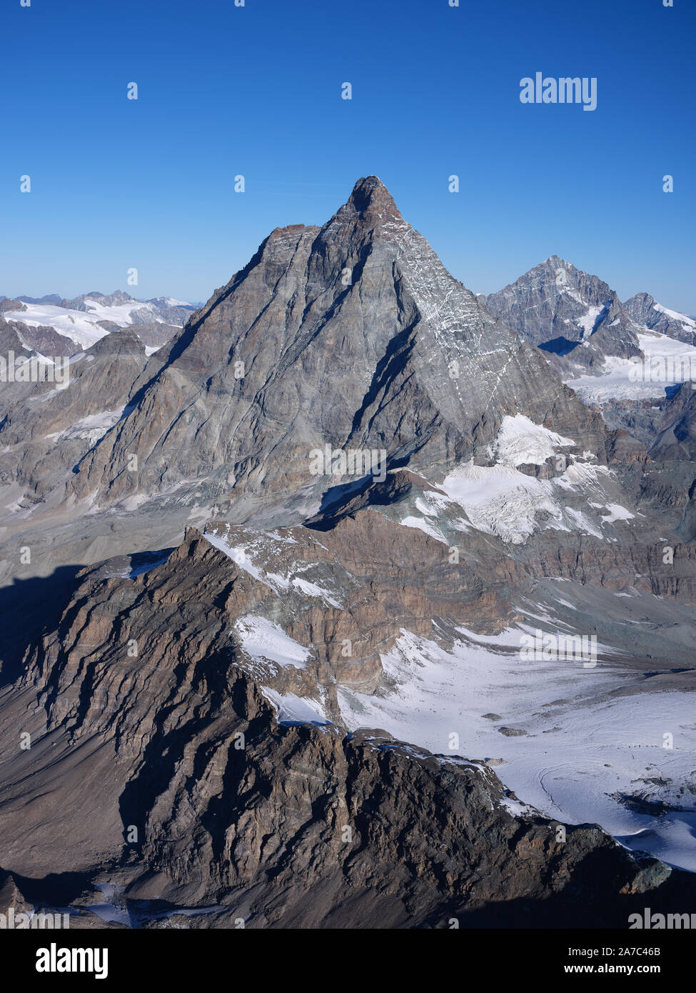 AERIAL VIEW from the east. 4478m-high Matterhorn / Cervino. Aosta Valley, italy (left of ridge) and Canton of Valais, Switzerland (right of ridge). Stock Photo