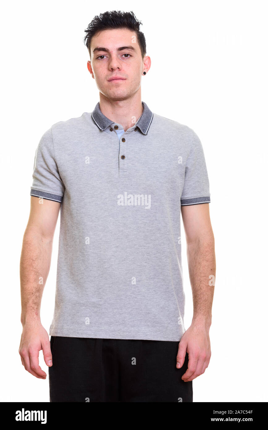 Studio shot of young handsome man isolated against white background ...