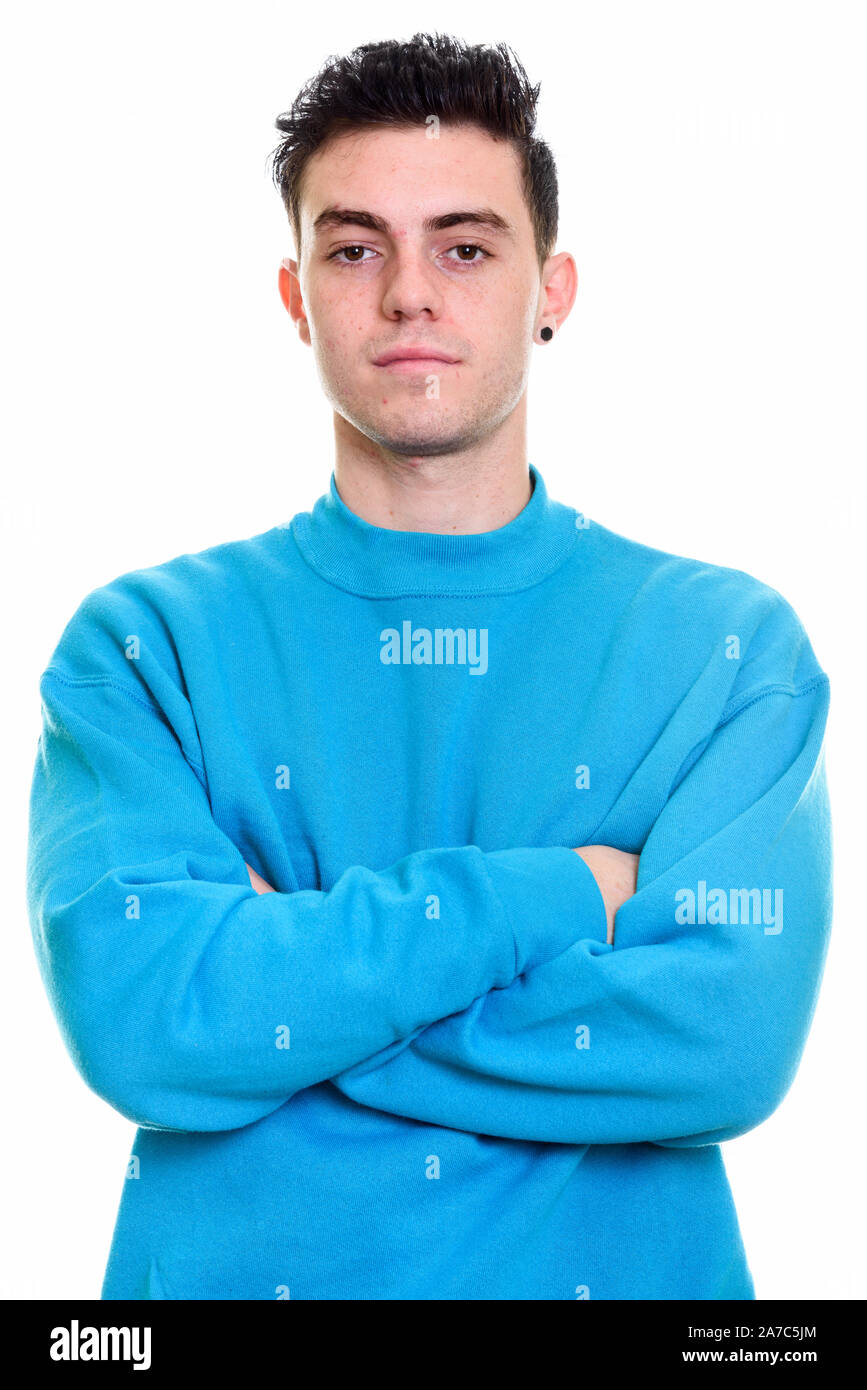 Studio shot of young handsome man isolated against white background ...