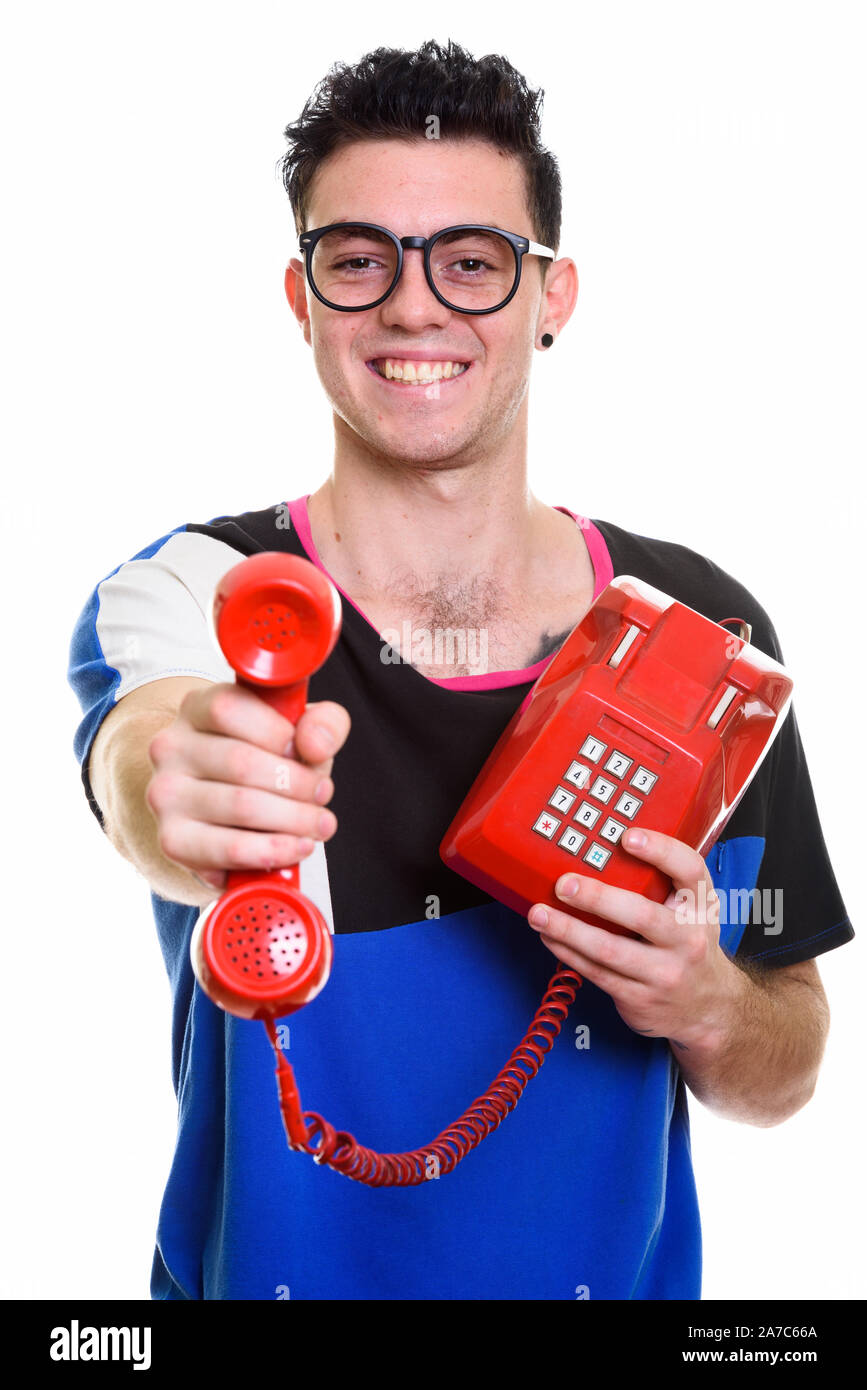 Studio shot of young handsome man isolated against white background ...