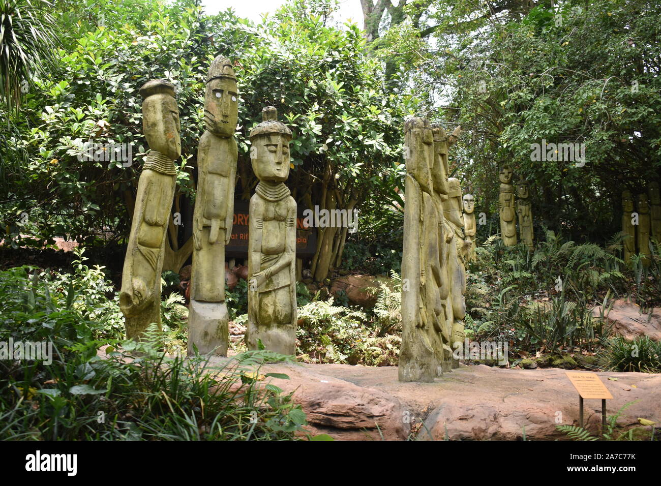 Singapore zoo, Singapore/Asia- 13th august, 2019: three human shaped statue standing in the forest Stock Photo