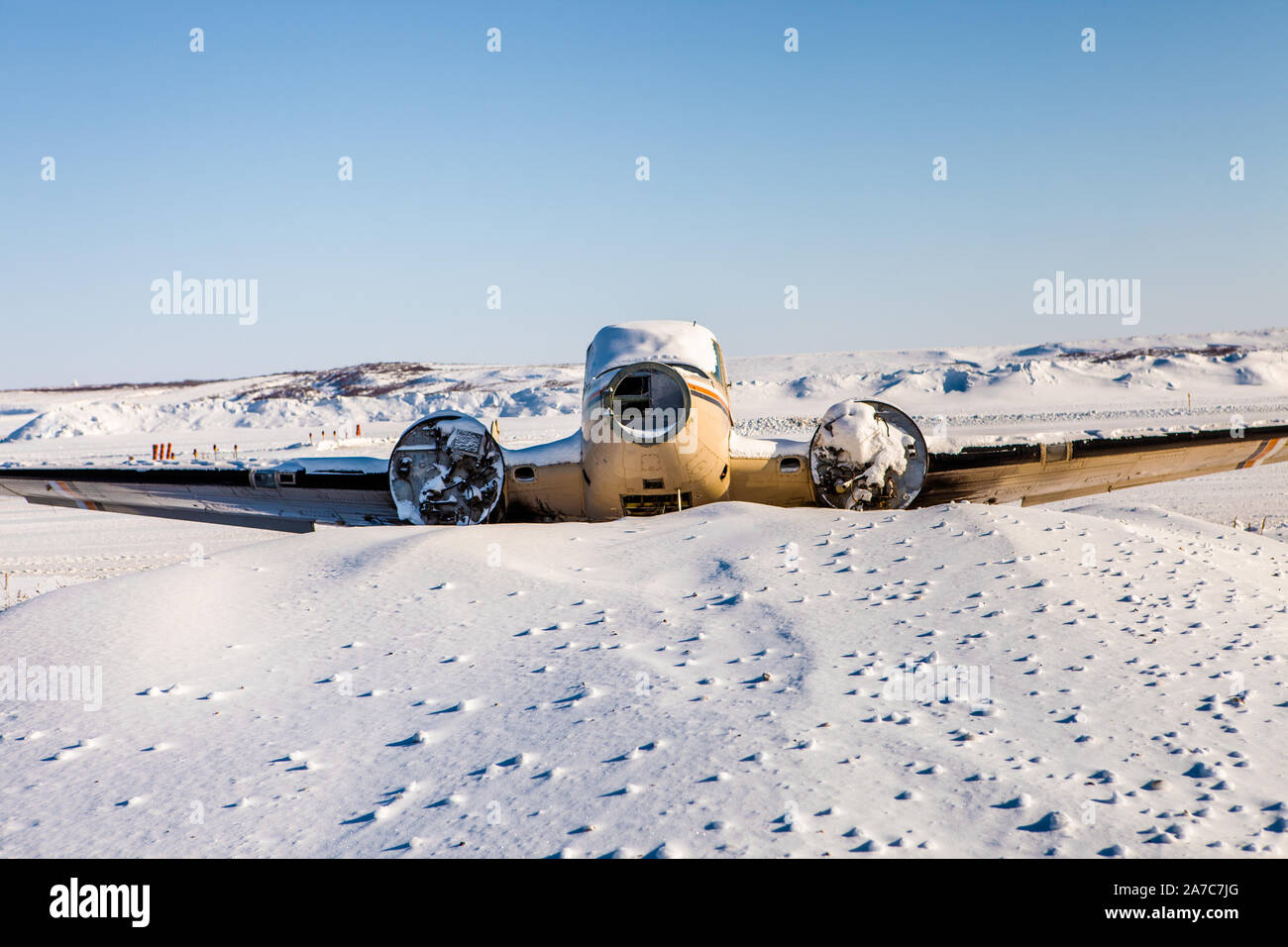 Aged aircraft after accident on uneven snowy land · Free Stock Photo
