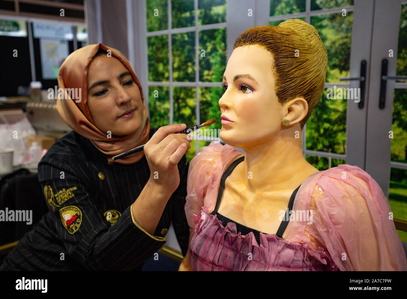 Tuba Geckil adding the finishing touches to her lifesize creation of