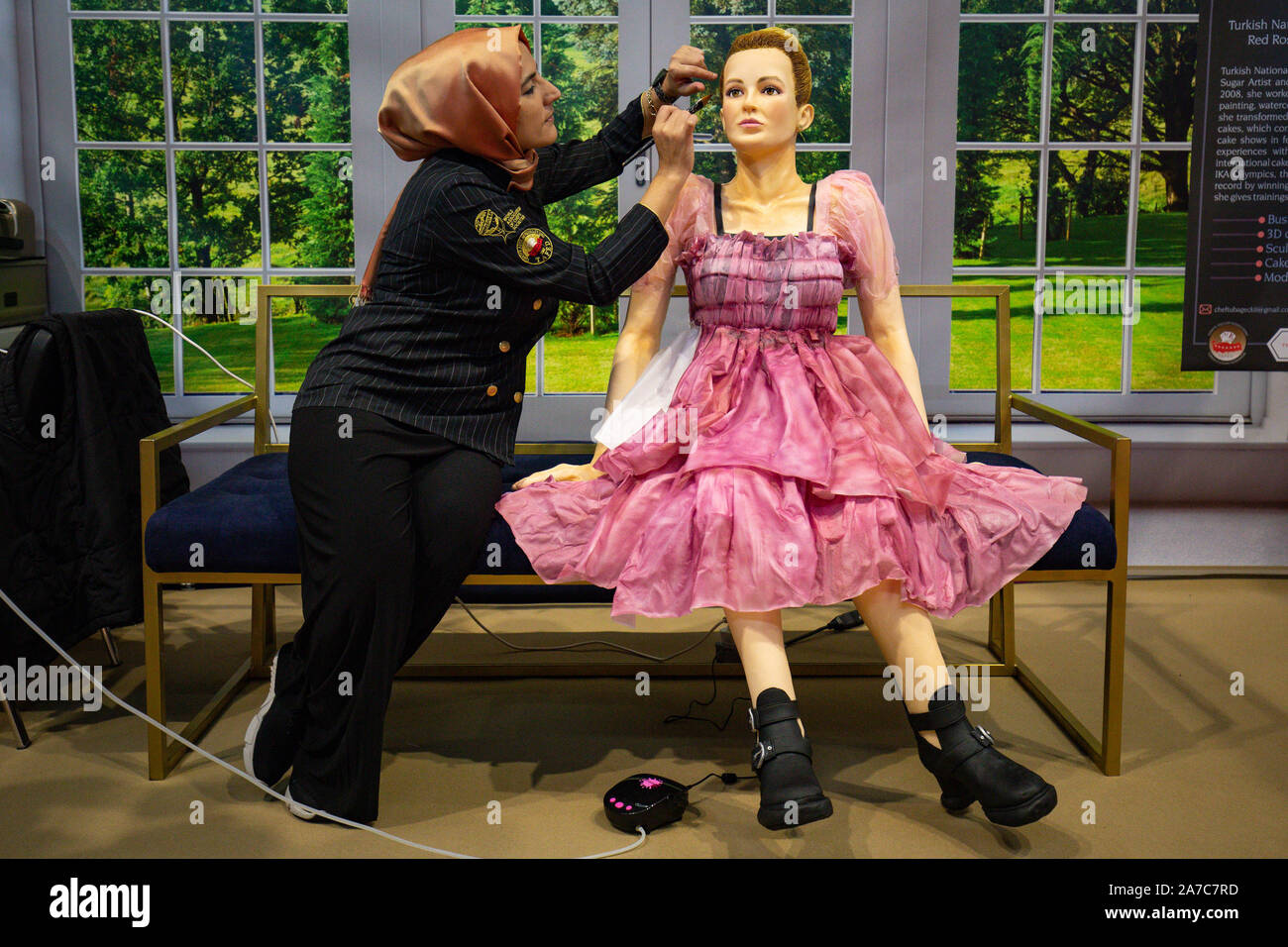 Tuba Geckil adding the finishing touches to her lifesize creation of