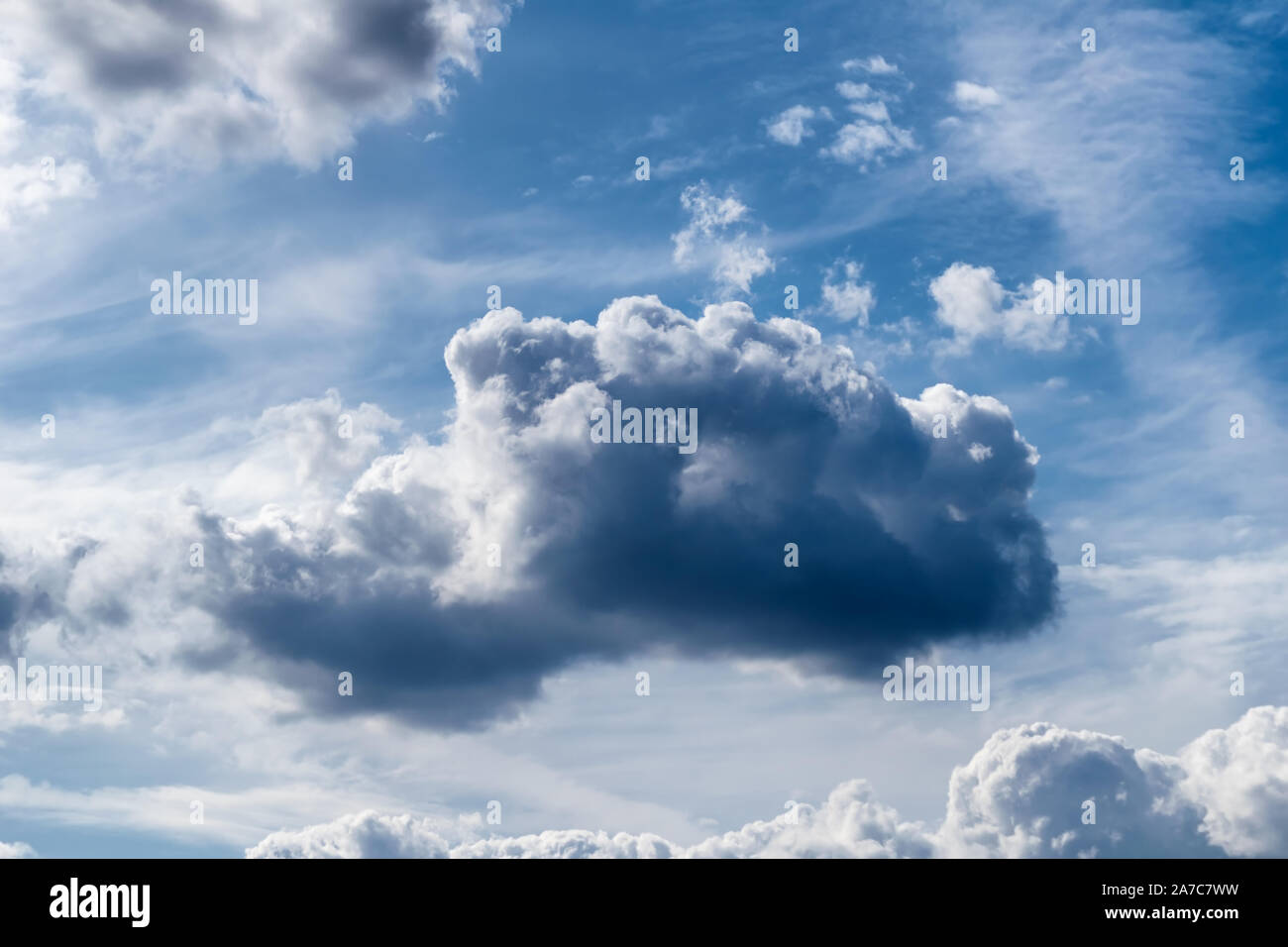 White cumulus clouds and a blue sky with sun rays after a storm Stock ...