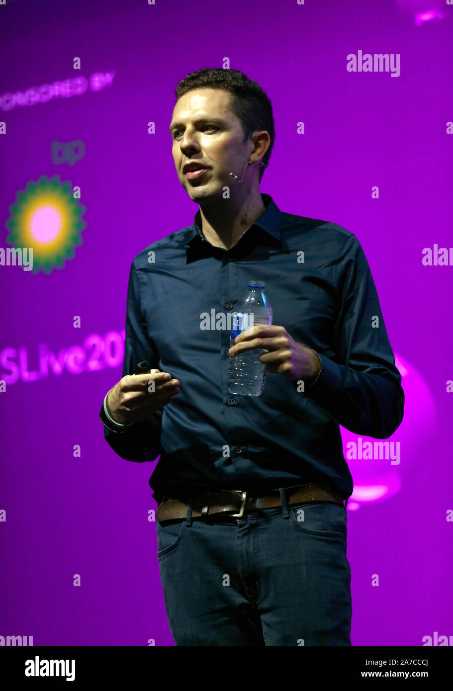 David Robson, Author explaining 'Why smart people make stupid mistakes', on the Humans Stage, at New Scientist Live 2019 Stock Photo
