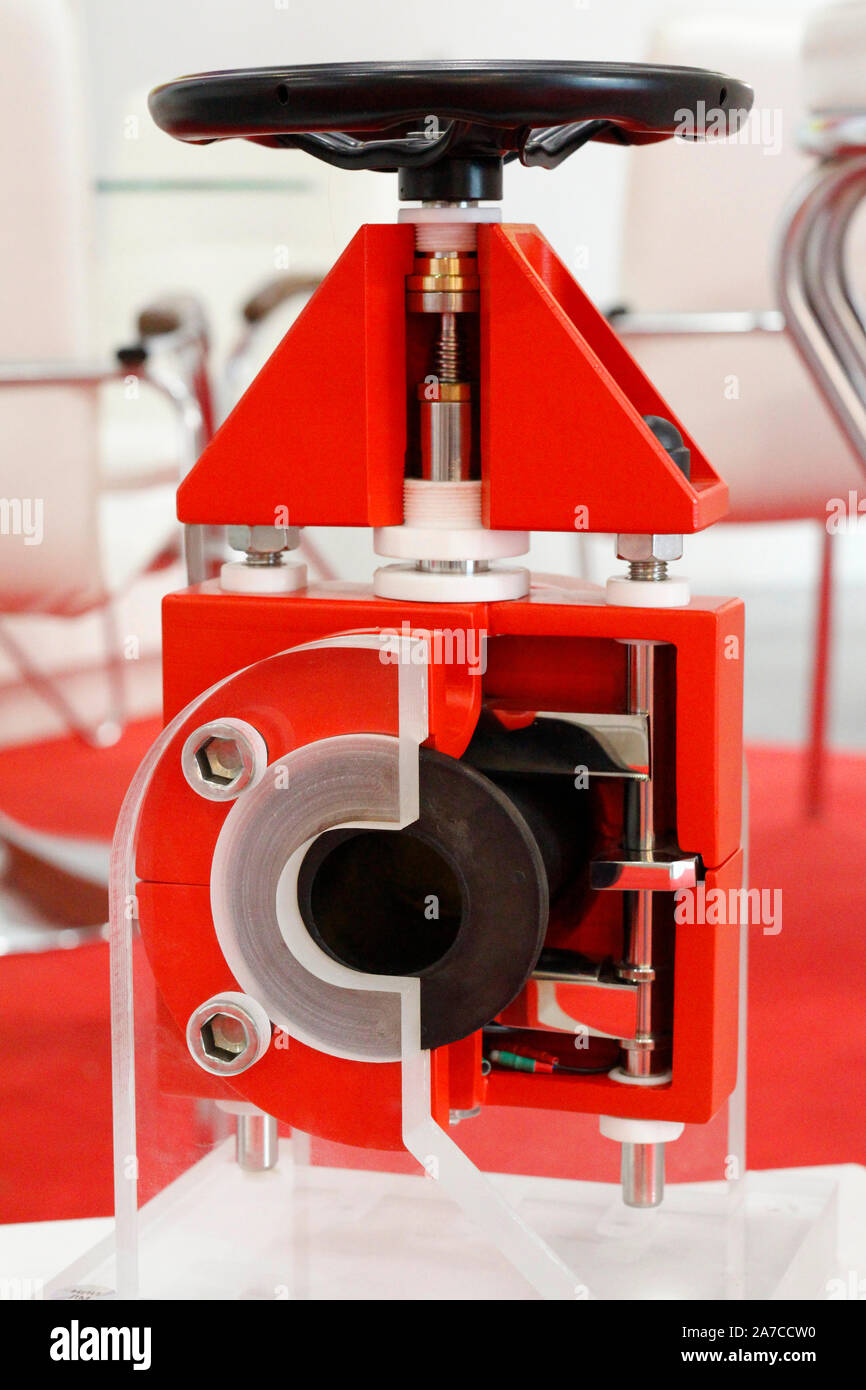 Manual shut-off valve shown in the photo in section. You see a cross section of a valve for controlling flow using open or closed positions. Stock Photo