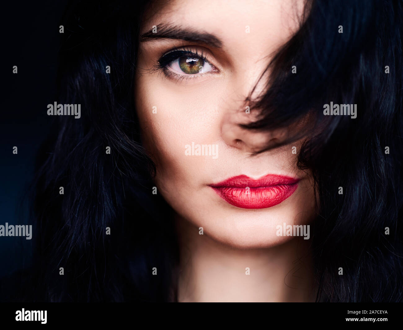 Beautiful young woman with green eyes Stock Photo