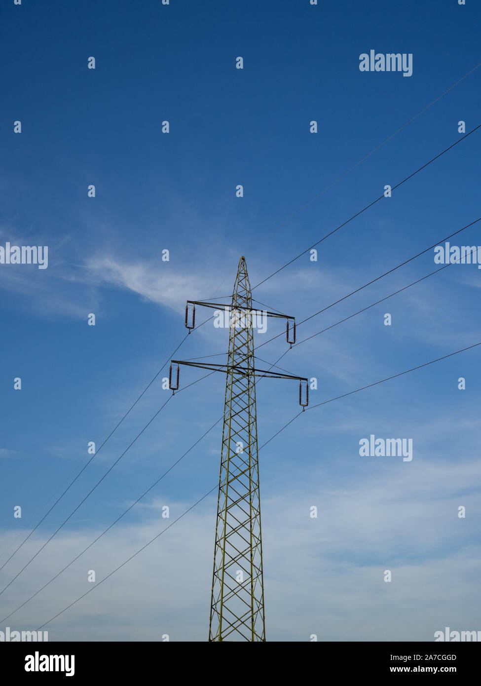 Electricity pylon and blue sky and clouds Stock Photo - Alamy