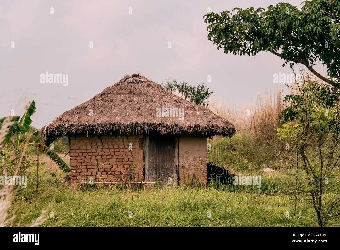 Thatched,cottage,made of,clay bricks,in a lonely ,place,Lalgarh,Jhargram,West Bengal,India Stock Photo