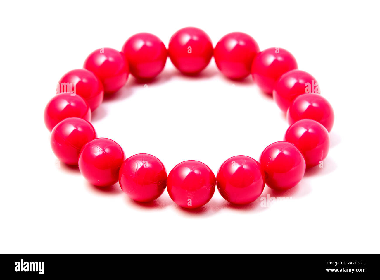 Pink plastic beaded bracelet on a white backround Stock Photo
