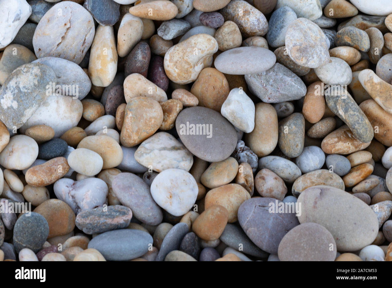 Pebbles as a background image Stock Photo - Alamy