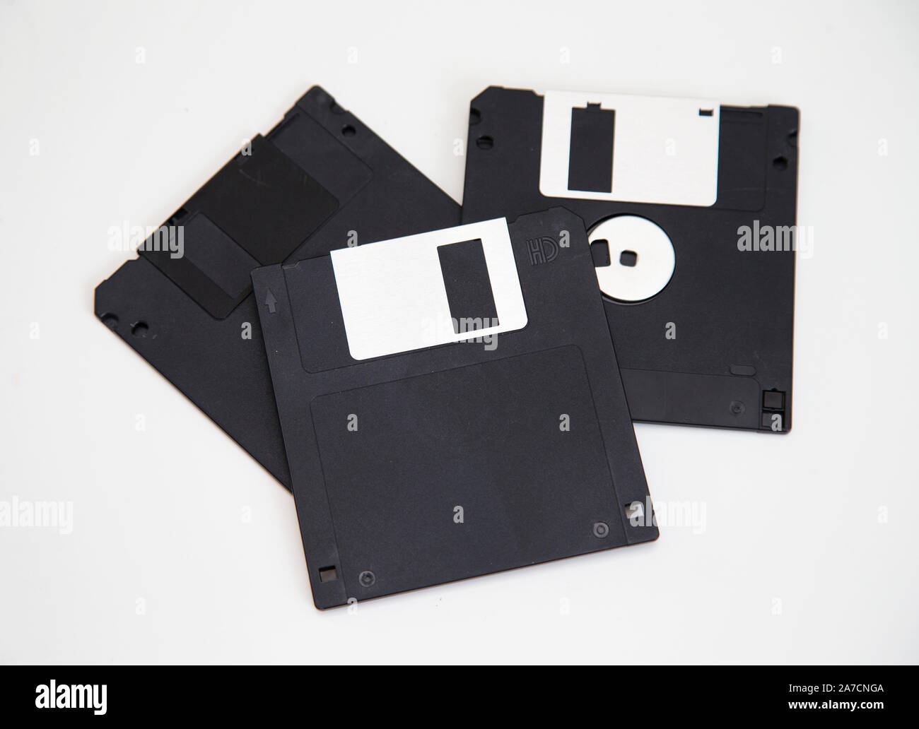 Diskettes for a computer. A floppy disk, also known as a floppy, diskette, or simply disk, is a type of disk storage composed of a disk of thin and flexible magnetic storage medium, sealed in a rectangular plastic enclosure lined with fabric that removes dust particles.Photo Jeppe Gustafsson Stock Photo