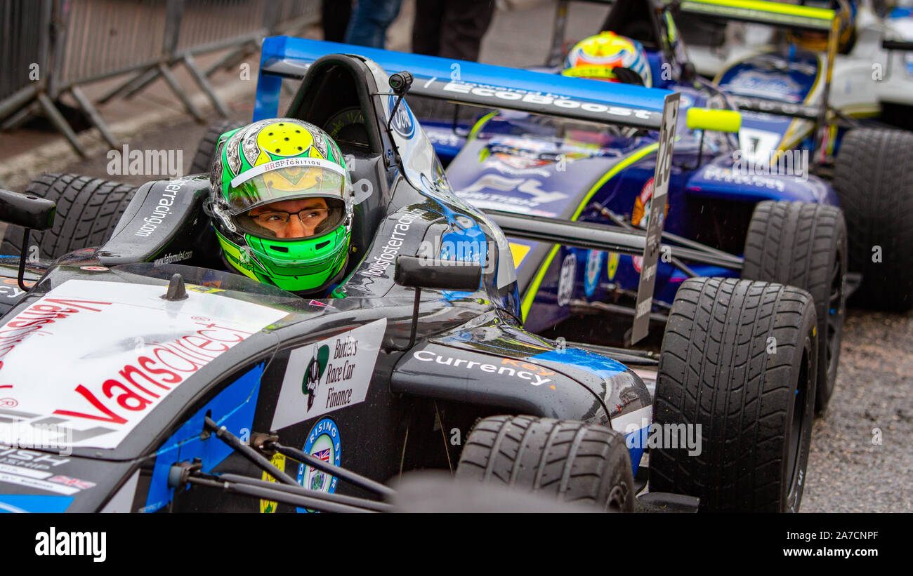 Louis Foster, 3rd in Championship, waits in his carbefore the first race of the weekend. British Formula 4. Last race weekend of series, 12 Oct 2019 Stock Photo