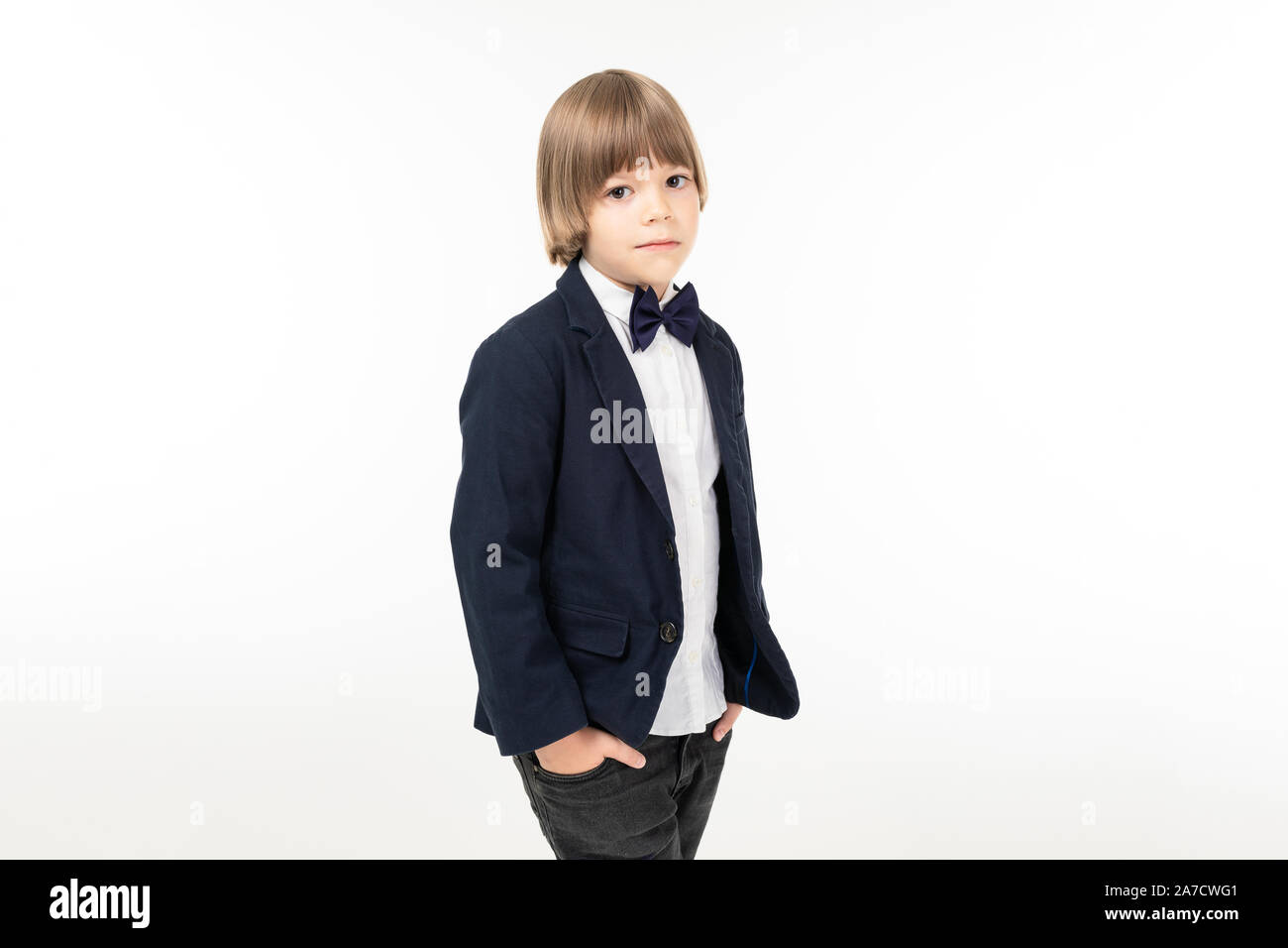 Picture os a teenager boy in black suit stands and pose isolated on ...