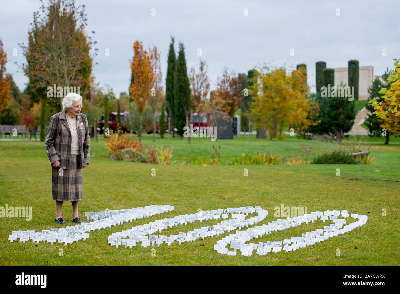 Bletchley Park veteran Betty Webb, 96, views a commemorative display of personal messages from staff at an event to mark 100 years of the Government Communications Headquarters (GCHQ), at the National Memorial Arboretum in Alrewas, Staffordshire. Stock Photo