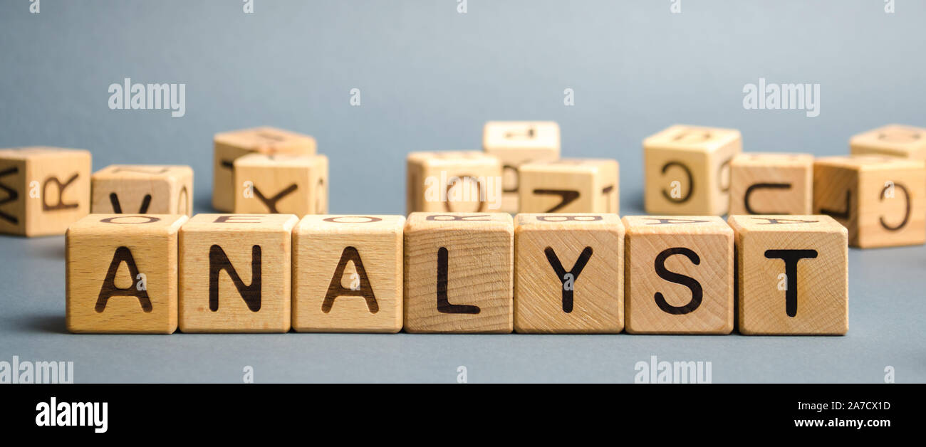 Wooden blocks with the word Analyst. Analytical reasoning and research. Forecasting processes and developing promising development programs. Stock Photo