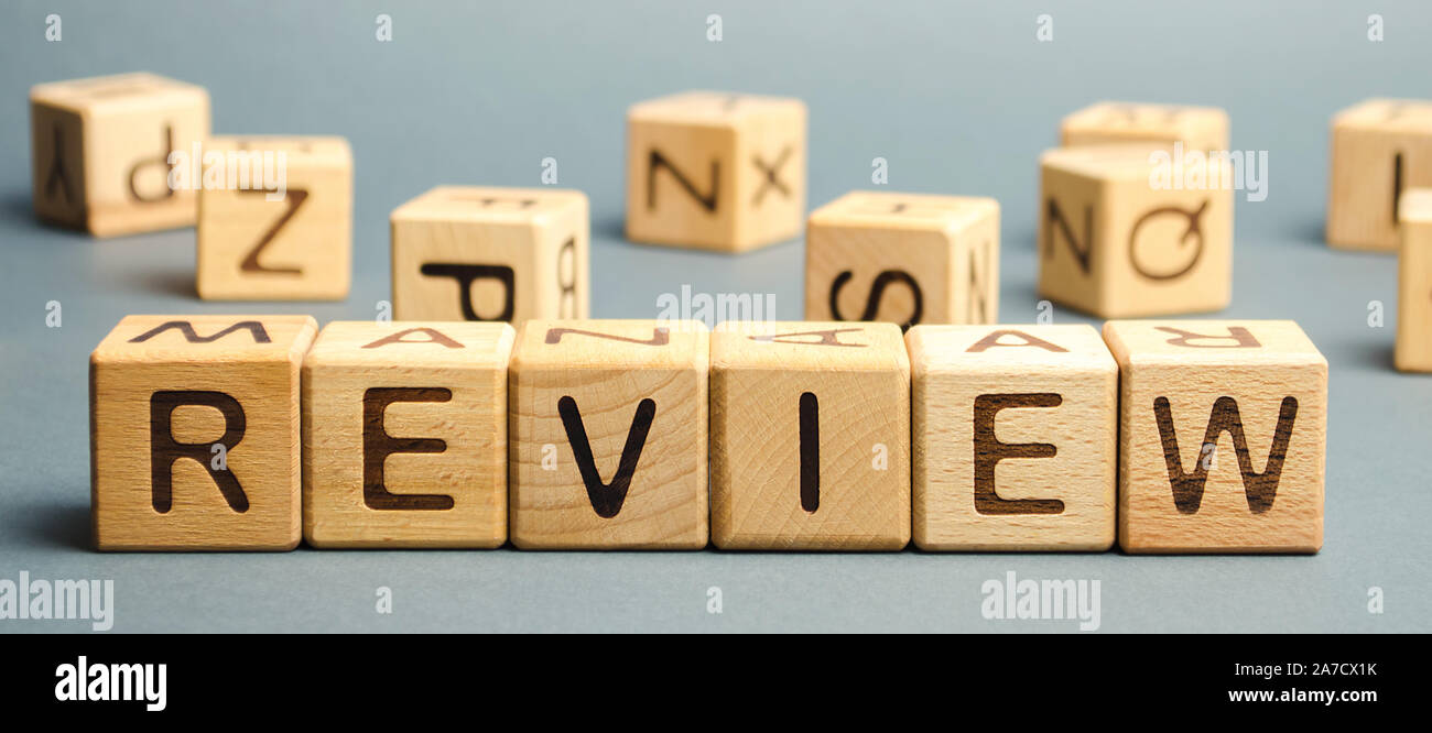 Wooden blocks with the word Review. Customer review concept. Reviewing