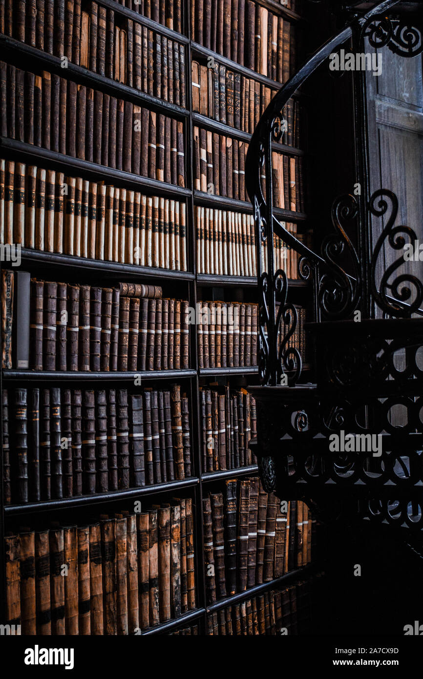 Bookshelf spiral staircase Trinity College library Stock Photo