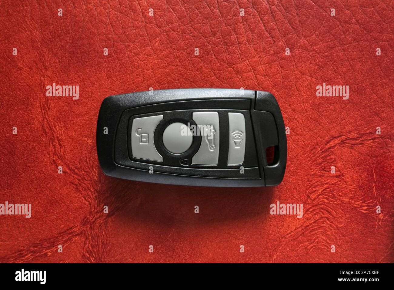 Wireless car key on leather background Stock Photo Alamy