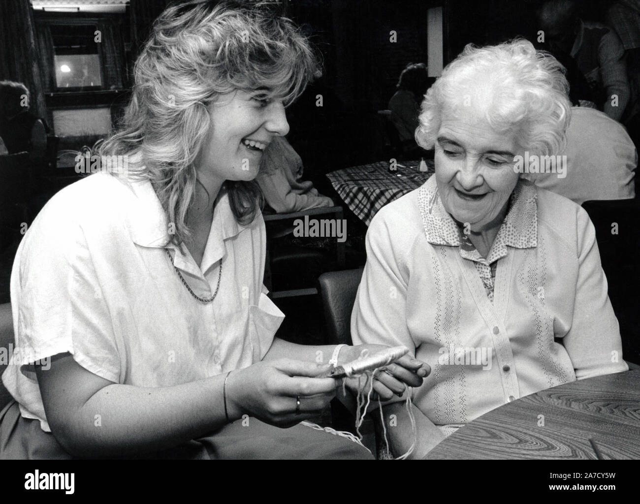 Care worker with elderly woman in residential care home, Nottingham, UK 1987 Stock Photo