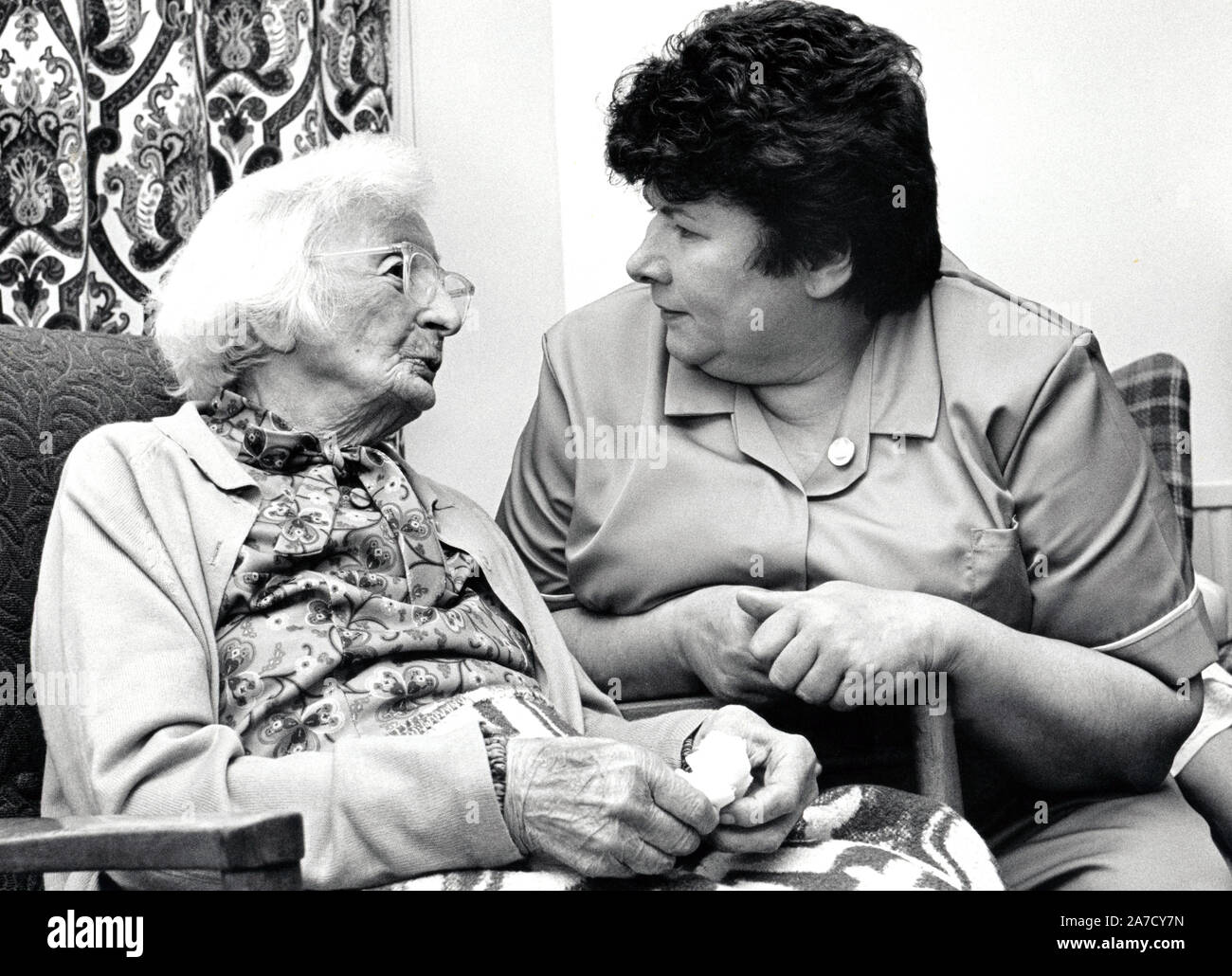 Care worker and elderly woman, Loughborough UK May 1988 Stock Photo