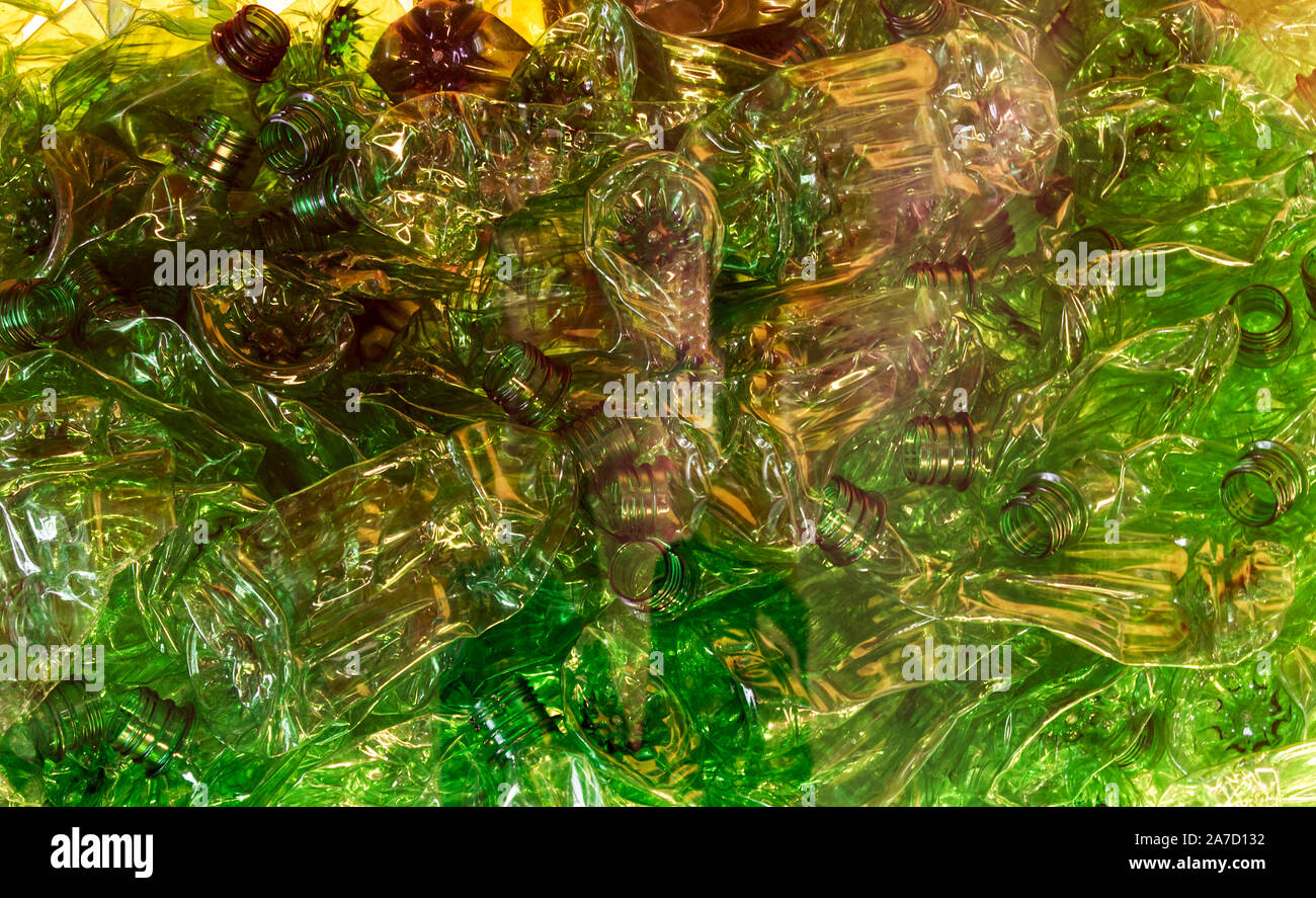 Crushed green PET plastic bottles. Concept of recycling. Say no to