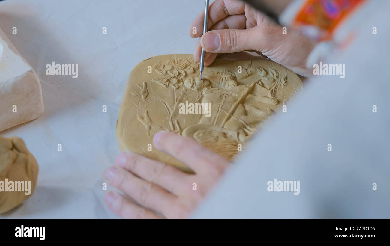 Potter making clay stamp picture Stock Photo Alamy