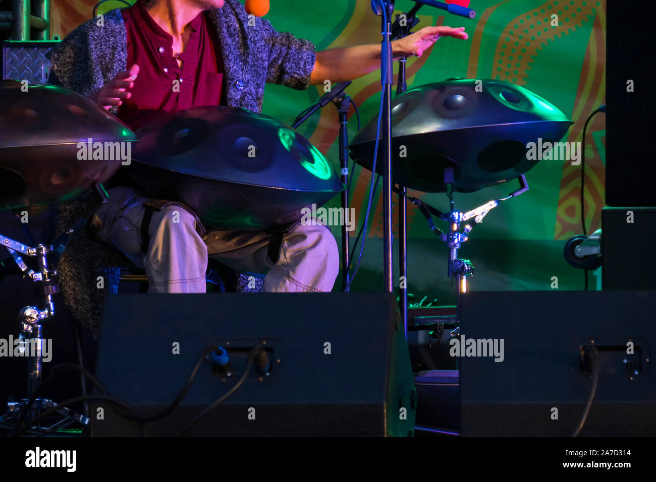 Unrecognizable man playing hang drum Stock Photo