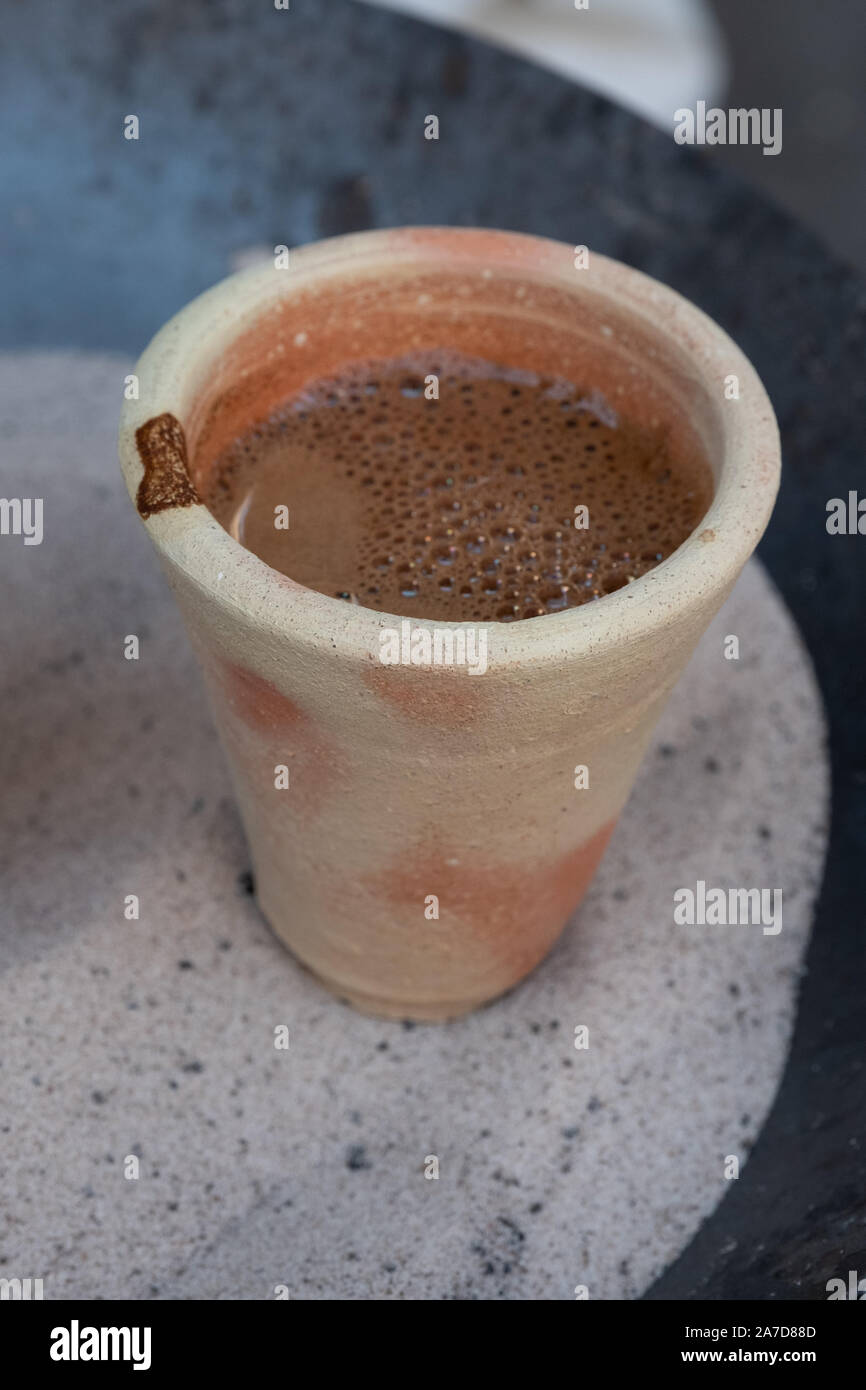 cups of desert arabic coffee on hot sand Stock Photo