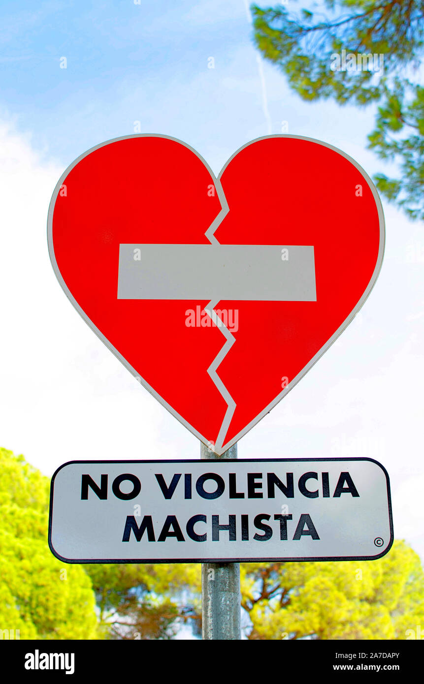 Heart-shaped traffic sign 'No Violencia Machista' in spanish ('No male violence against women') in the Oromana Park Stock Photo