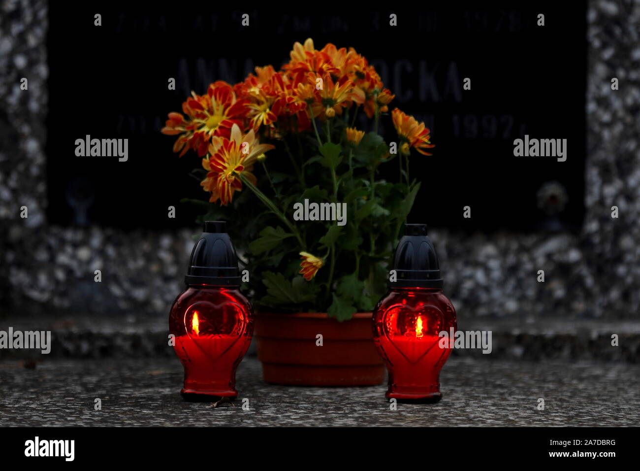 cemetery,bouquet of flowers in a vase at the cemetery, candles on the