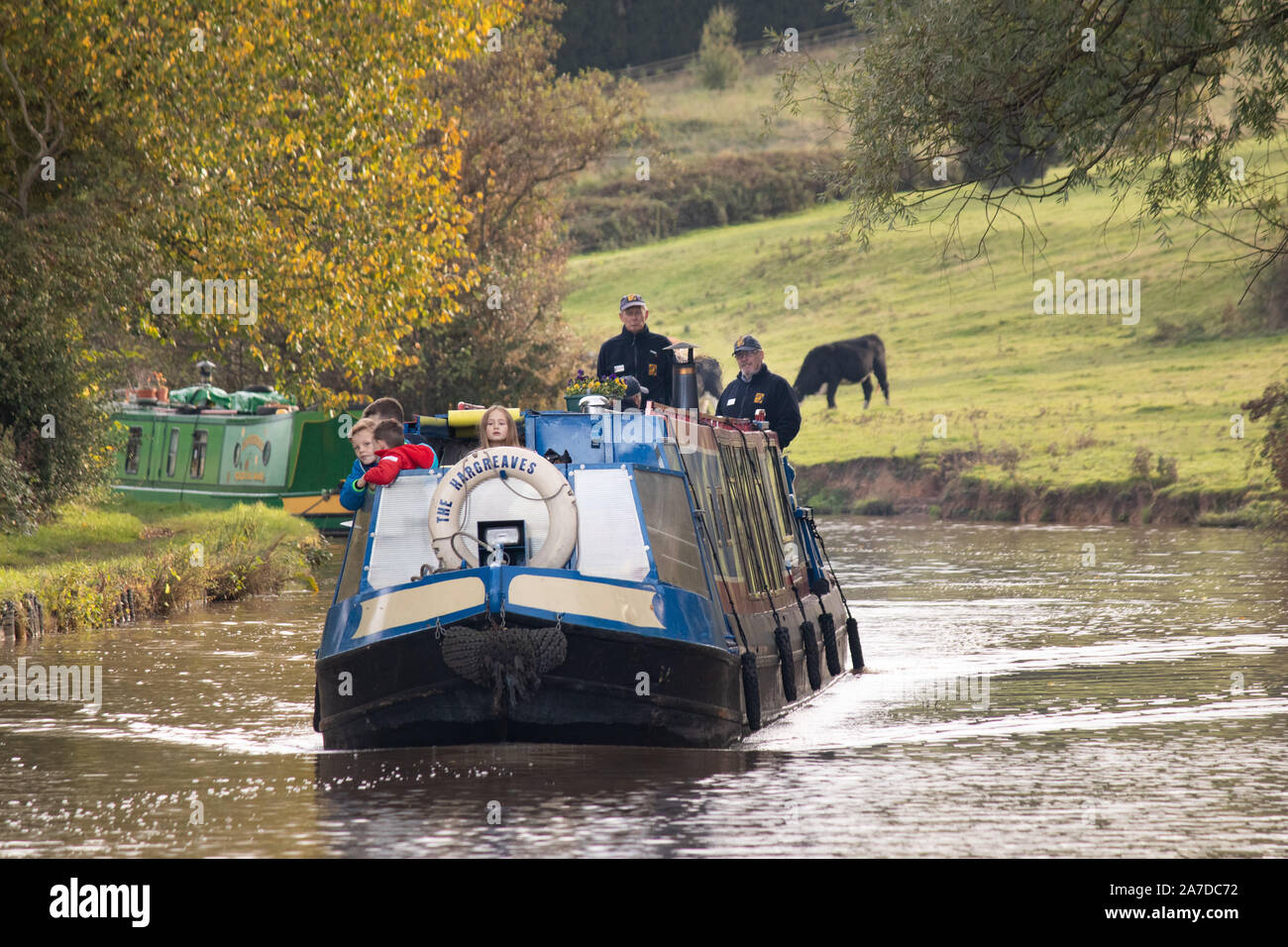 A canal boat makes it's way along the Coventry canal near Nuneaton. Stock Photo
