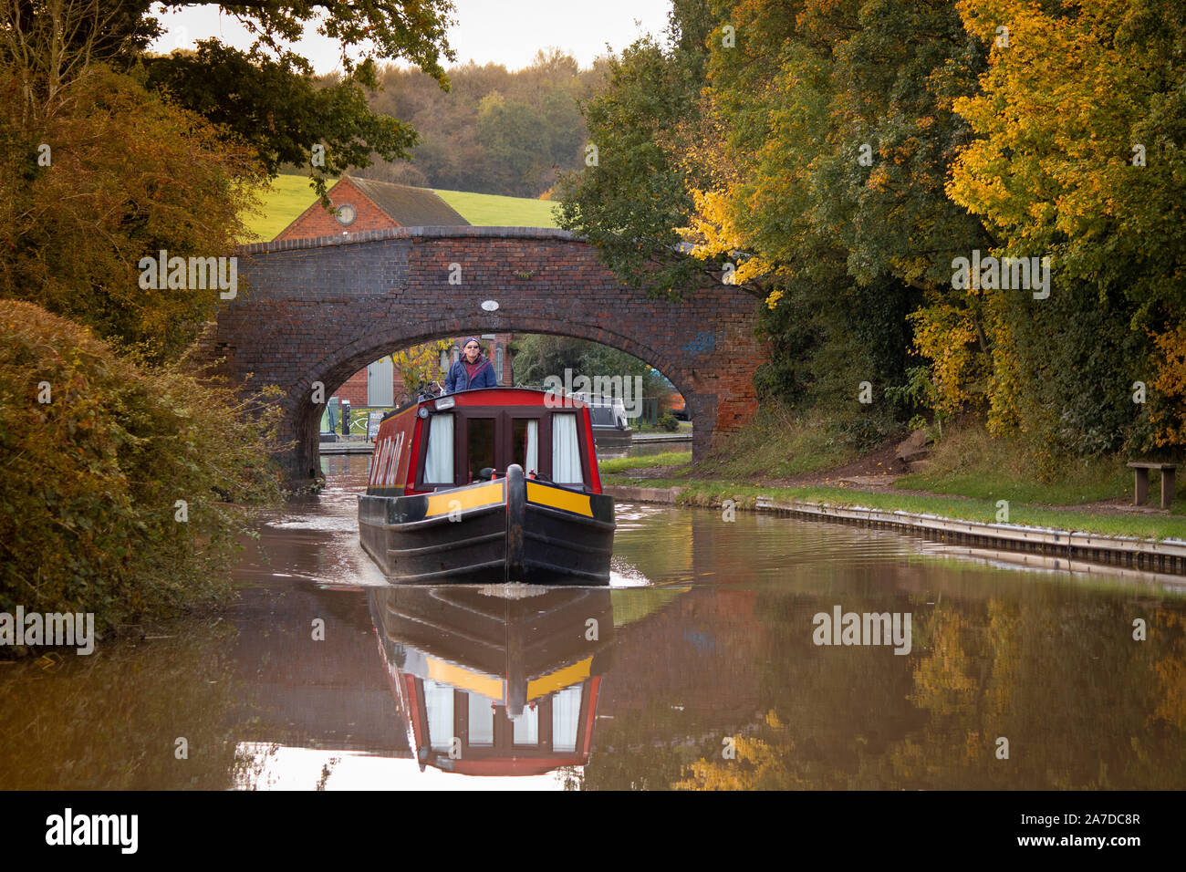 A canal boat makes it's way along the Coventry canal near Nuneaton. Stock Photo