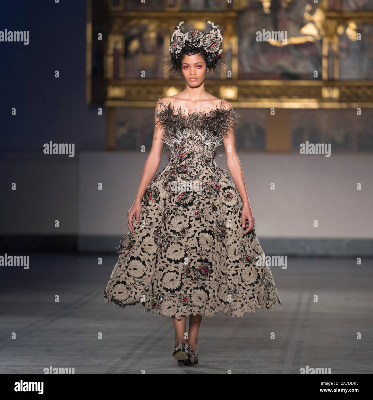 V&A, London, UK. 1st November 2019. Guo Pei, one of China’s most renowned designers, holds first ever runway show in the UK, staged to celebrate the 20th anniversary of the V&A’s Fashion in Motion series, in the dramatic setting of the museum’s Raphael Gallery, models wear colourful pieces from the designers’ AW 2019/20 Alternate Universe Couture collection. Credit: Malcolm Park/Alamy Live News. Stock Photo