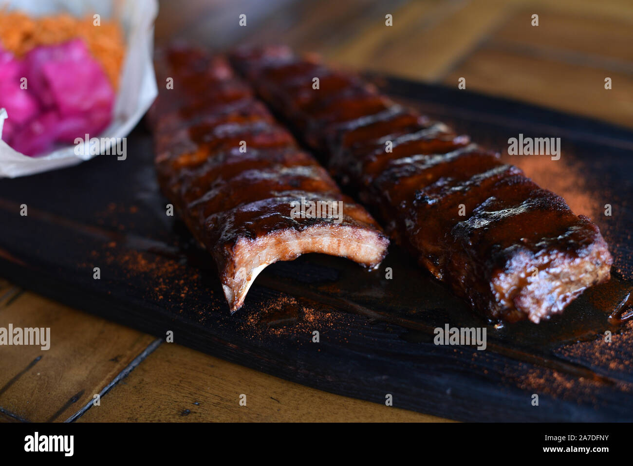 Delicious Bbq Ribs Cole Slaw And A Tangy Bbq Sauce Salinity Carrots And Cabbage With Beets Ribs With Vegetables In A Beer Bar Or Cafe Restaurant Stock Photo Alamy