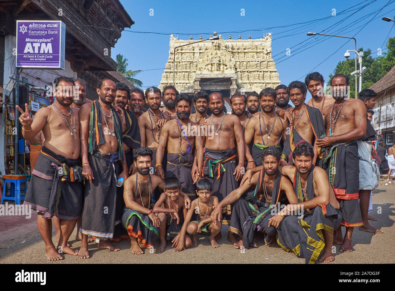 A large group of male Hindu pilgrims posing in front of Padmanabhaswamy Temple in Trivandrum, Kerala, India, which invaluable treasures were  found Stock Photo