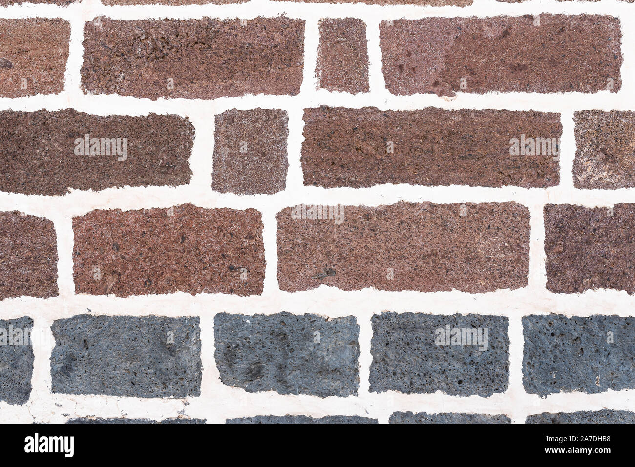 old brick wall background with white grout in joints Stock Photo